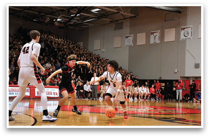 A basketball game is taking place with a player in the foreground holding a basketball. AI generated content