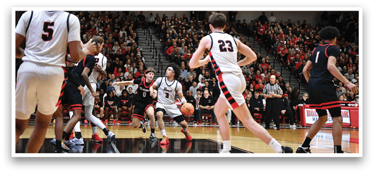 A basketball game is taking place with a crowd of people watching. The players are running and chasing the ball. AI generated content