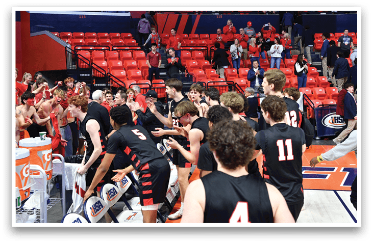 A group of young men celebrating a victory on a basketball court. AI generated content
