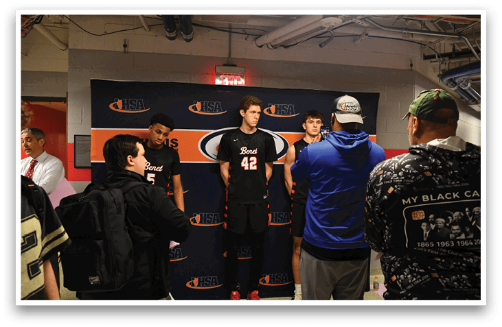 A group of young men wearing basketball uniforms stand in front of a blue backdrop. AI generated content