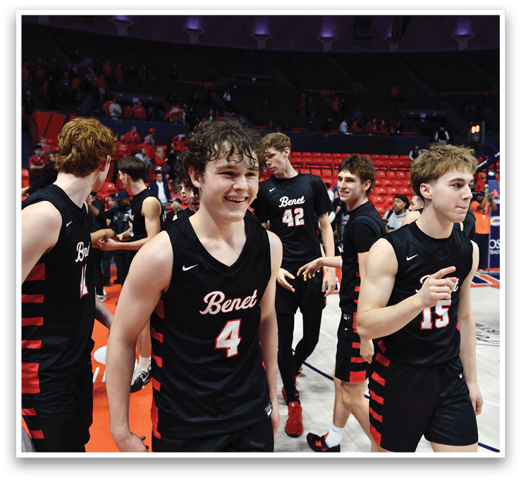A group of young men wearing black jerseys are standing on a basketball court, smiling and celebrating their victory. AI generated content