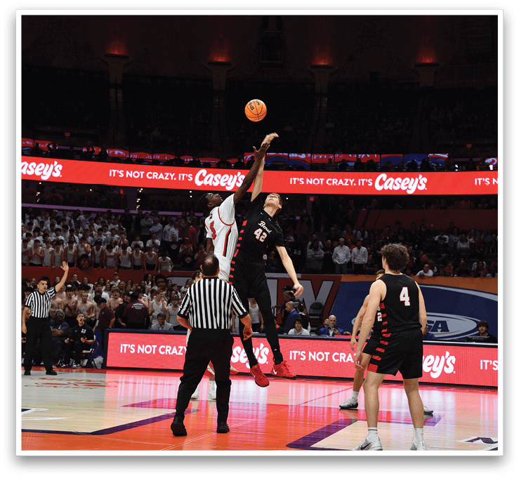 Basketball players on a court, one of them jumping to block a shot. AI generated content