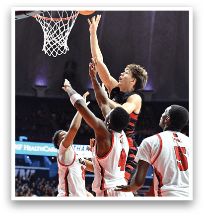 A group of basketball players are trying to get the ball. AI generated content