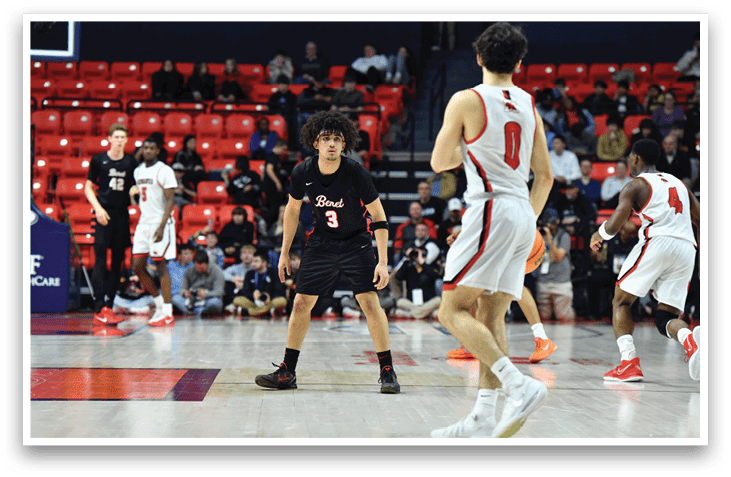 A group of men playing basketball on a court. AI generated content