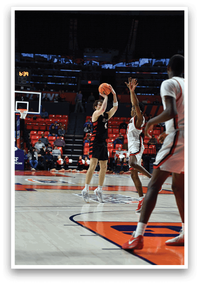 A basketball game is in progress with a player attempting to shoot the ball. AI generated content