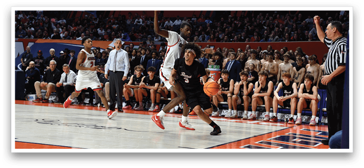 A basketball game is taking place with a group of men playing. One man is jumping in the air to grab the basketball while another man is trying to block him. The crowd is watching the game intently. AI generated content