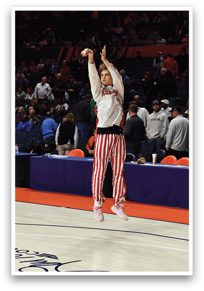 A basketball player is jumping in the air to shoot the ball. AI generated content