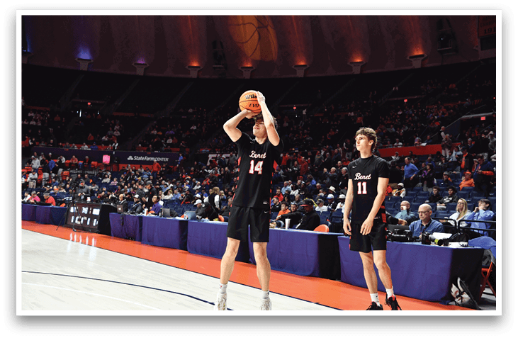 Two basketball players are on the court, one holding a basketball and the other looking on. The players are wearing black uniforms. AI generated content