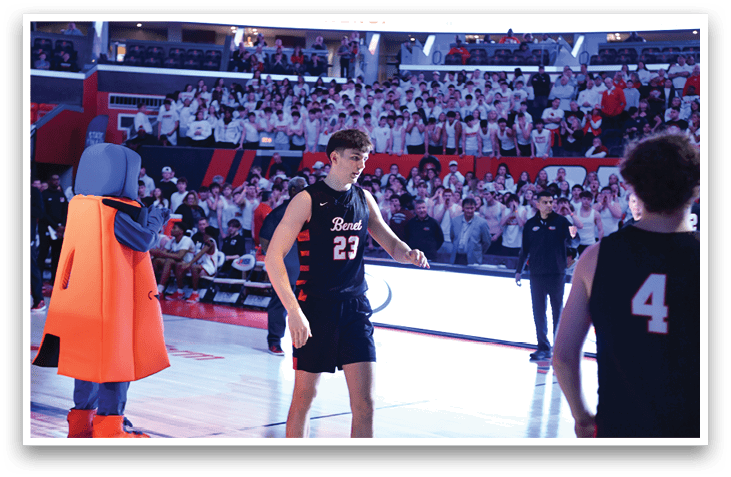 A man wearing a basketball uniform stands on a basketball court. AI generated content