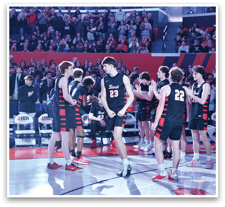 A group of young men wearing black uniforms are standing on a basketball court. AI generated content