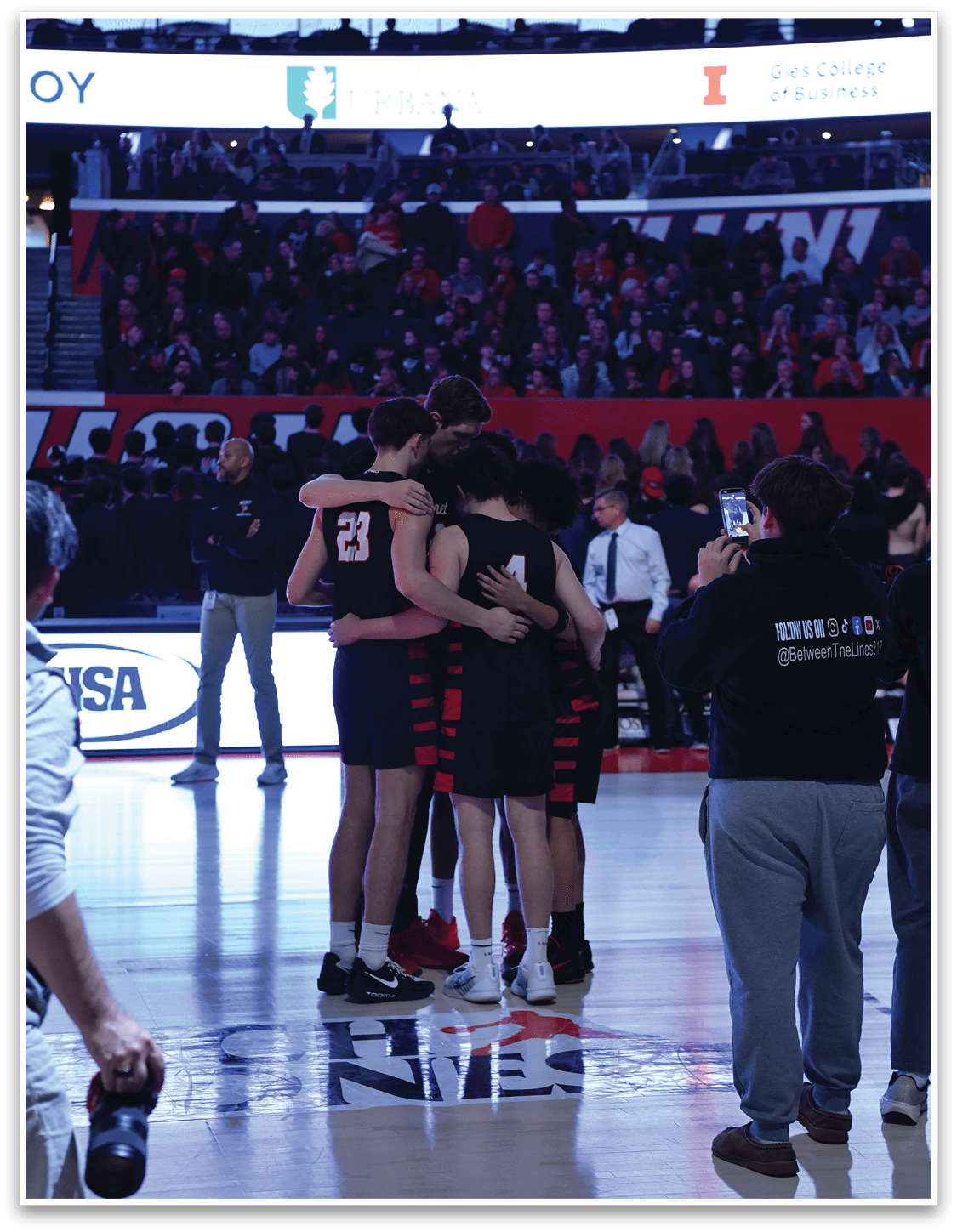 A group of people hugging on a basketball court. AI generated content