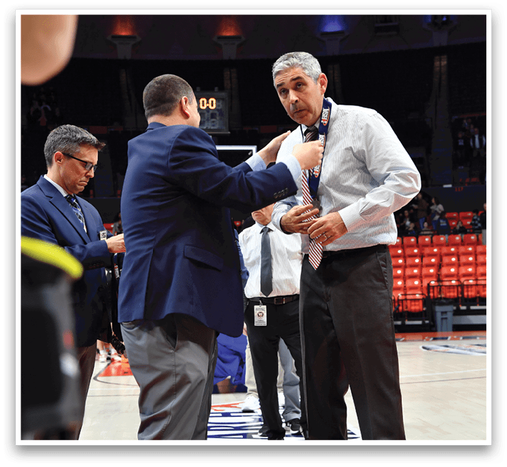 Two men shake hands on a basketball court. AI generated content