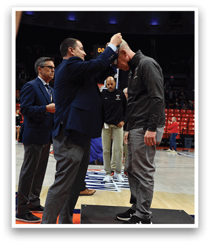 Three men are standing on a basketball court, shaking hands. AI generated content