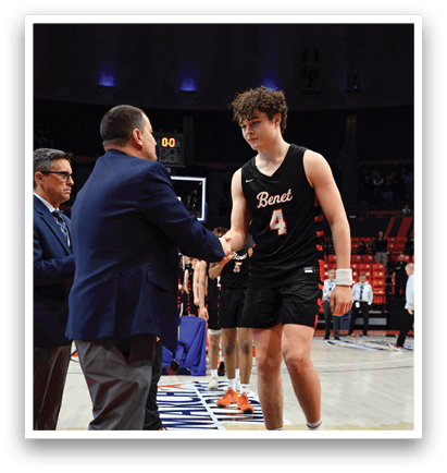 Two men shake hands on a basketball court. AI generated content