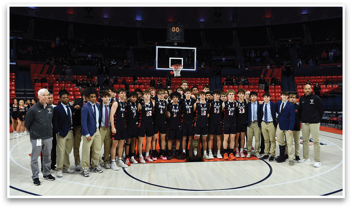 A group of young men pose for a photo on a basketball court. AI generated content