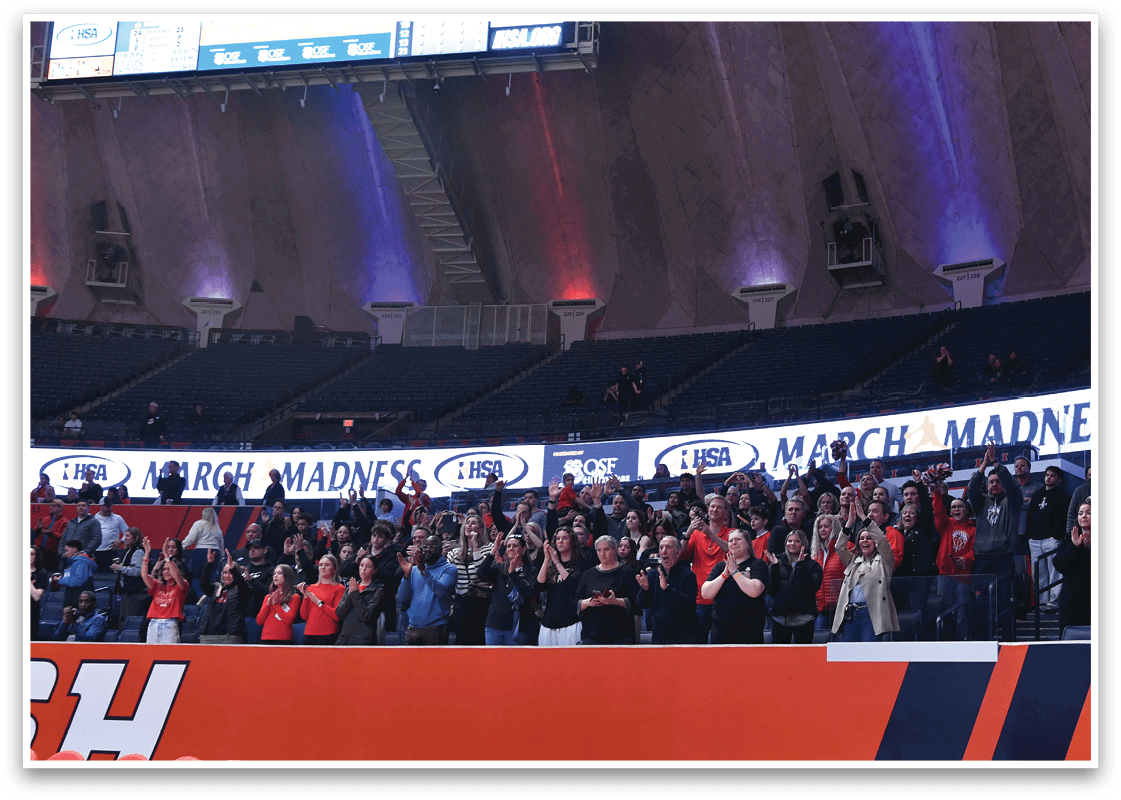 A large crowd of people are sitting in the stands of a stadium, watching a game. AI generated content