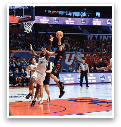 Basketball players on a court, one player is jumping to block a shot. AI generated content