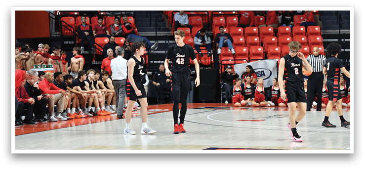 A group of young men are playing basketball on a court. AI generated content