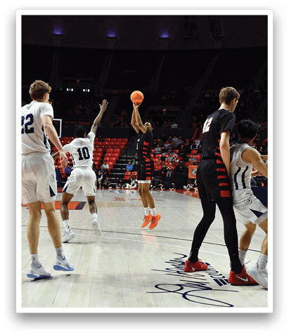 Basketball players on a court, one player is attempting to shoot the ball while others try to defend. AI generated content
