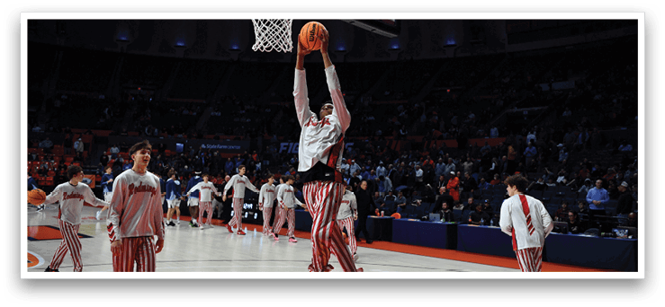 A basketball player jumps to dunk the ball through the hoop. AI generated content