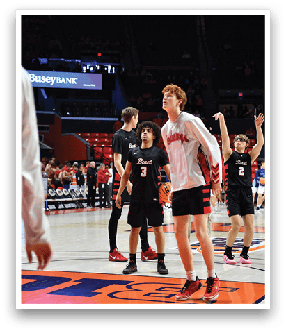 A group of basketball players are on the court, with one player holding his arms up in the air. AI generated content