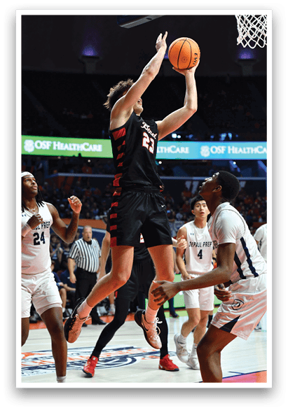 A basketball player is attempting to block a shot, while another player tries to get past him. AI generated content