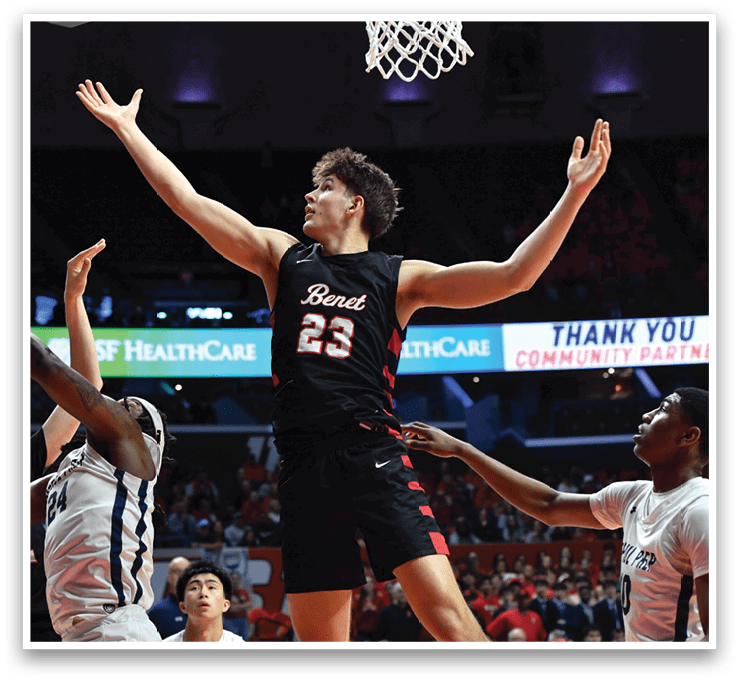 A basketball player is reaching for the ball in front of the basket while other players try to block him. AI generated content