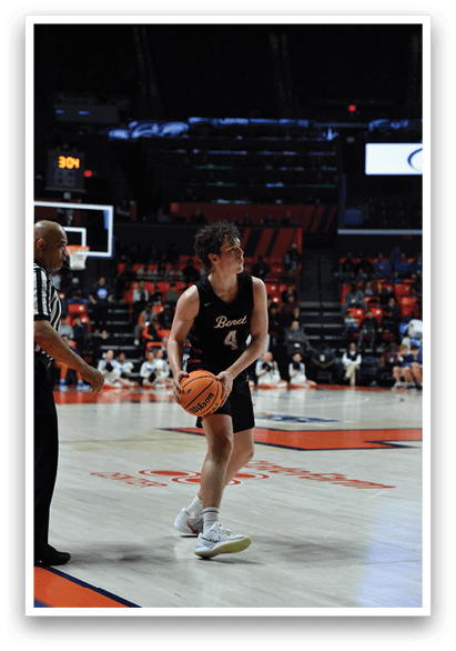 A man is holding a basketball on a court with a referee and other players. AI generated content
