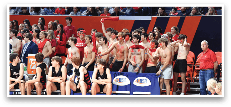 A group of people are sitting on a bench, some of them wearing red shirts. A man in the crowd is holding a red object. AI generated content