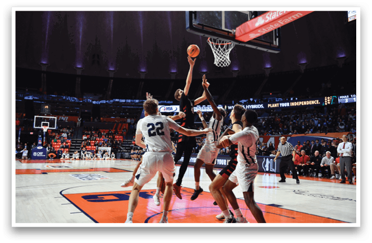 Basketball players on a court, one of them jumping to block a shot. AI generated content