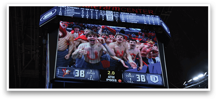 A large screen displays a group of people with painted faces, possibly celebrating a victory. AI generated content