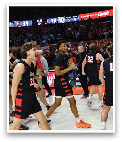 A group of young men celebrating a victory on a basketball court. AI generated content