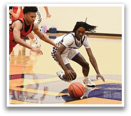 A group of people playing basketball on a court. One player is diving for a basketball, while others are running and watching the play. Contenido generado con IA