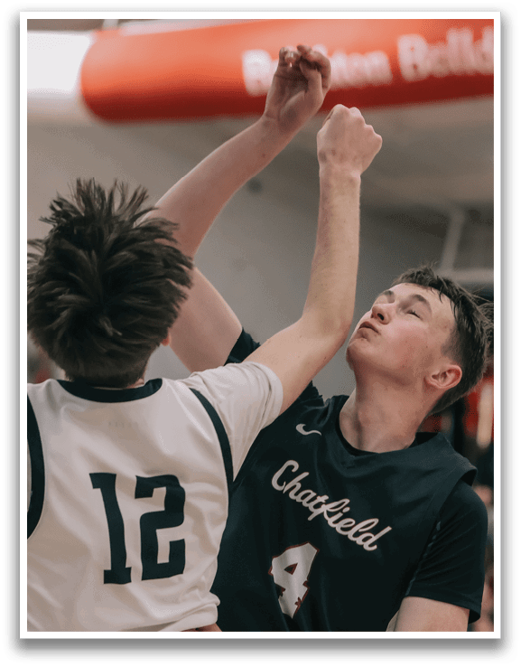 Two basketball players are fighting for the ball, with one player holding the ball and the other trying to block him. AI generated content