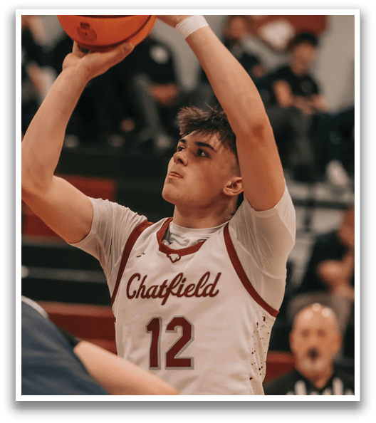 A basketball player in a white uniform is holding a basketball in his hands, preparing to shoot. AI generated content