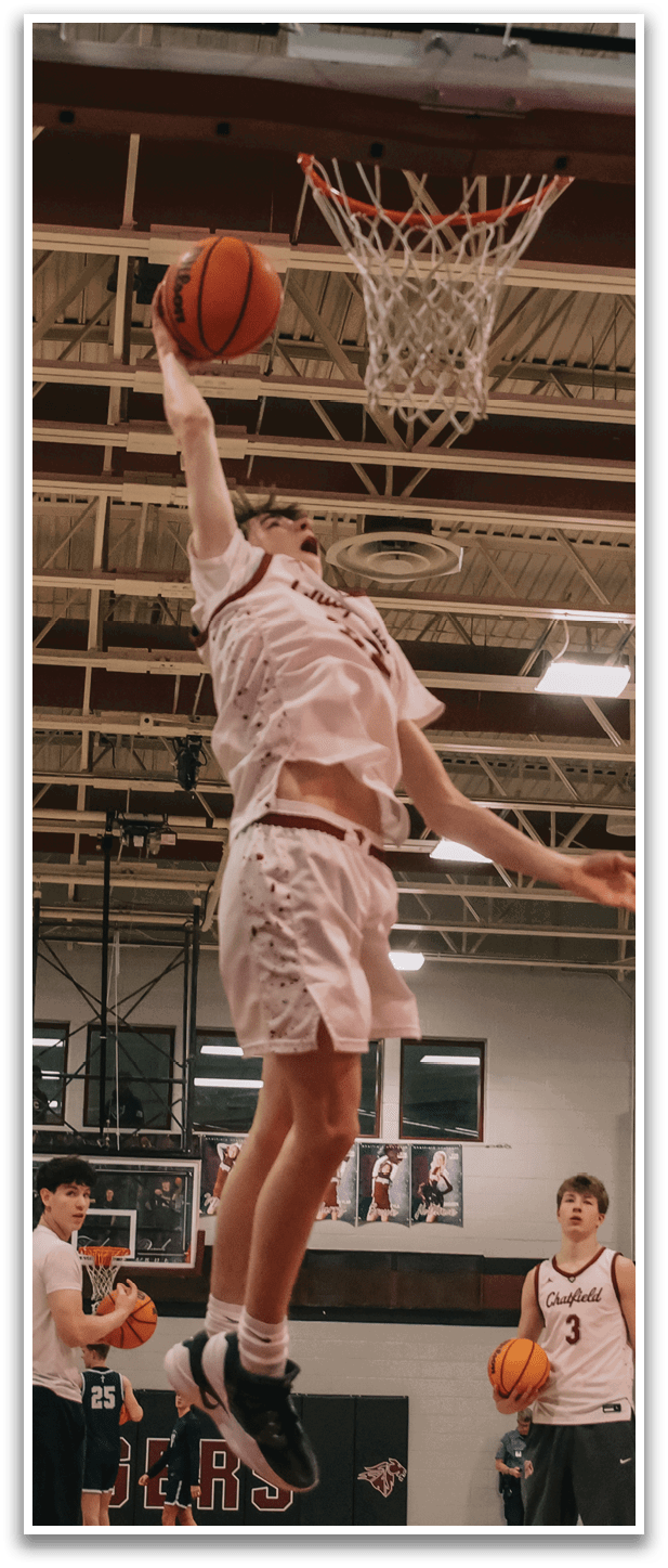 A basketball player leaps into the air to catch a ball. AI generated content