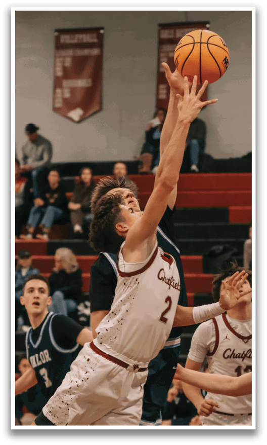 A basketball player leaps to block a shot, while the crowd watches intently. AI generated content