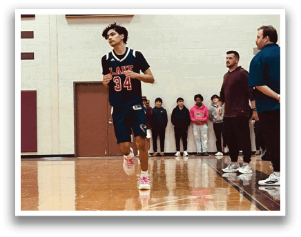 A basketball player is running on the court, wearing a blue uniform. AI generated content