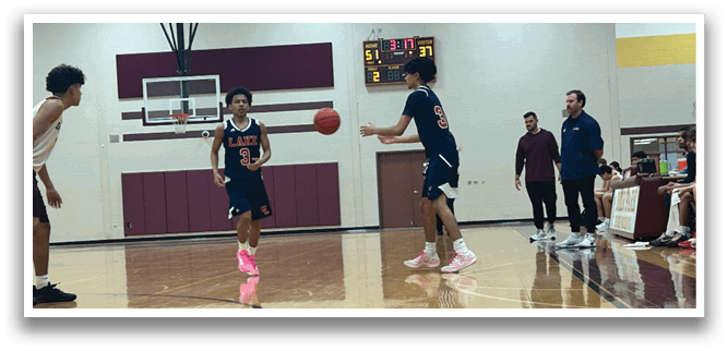 A group of young men playing basketball on a court. AI generated content