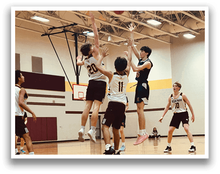 A group of young men playing basketball on a court. AI generated content