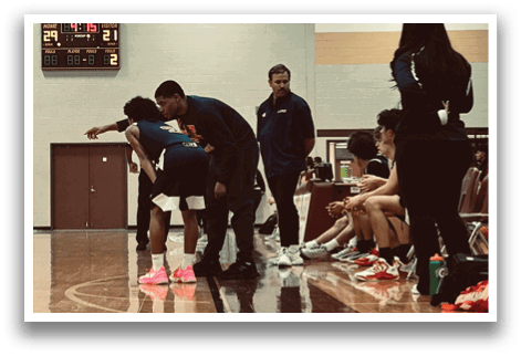 A group of people are playing basketball on a court. AI generated content