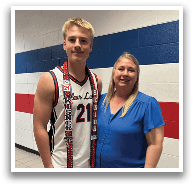 A man and woman pose for a picture, the man wearing a basketball uniform. AI generated content
