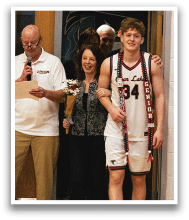 A man wearing a basketball jersey stands next to a woman. AI generated content