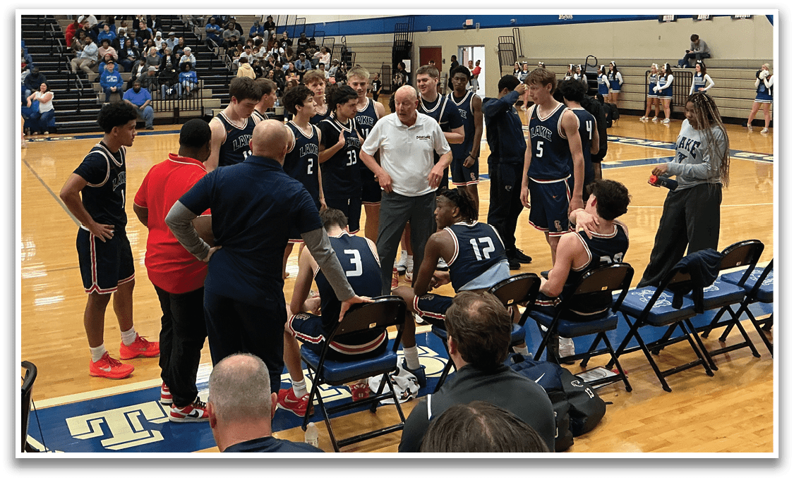 A group of people are sitting on chairs in a gym, with some of them talking to each other. A basketball court is visible in the background. AI generated content