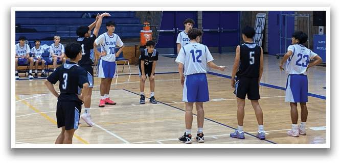 A group of young men playing basketball on a court. AI generated content