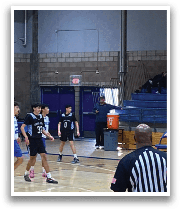 Basketball game in progress with players on the court and spectators in the stands. AI generated content