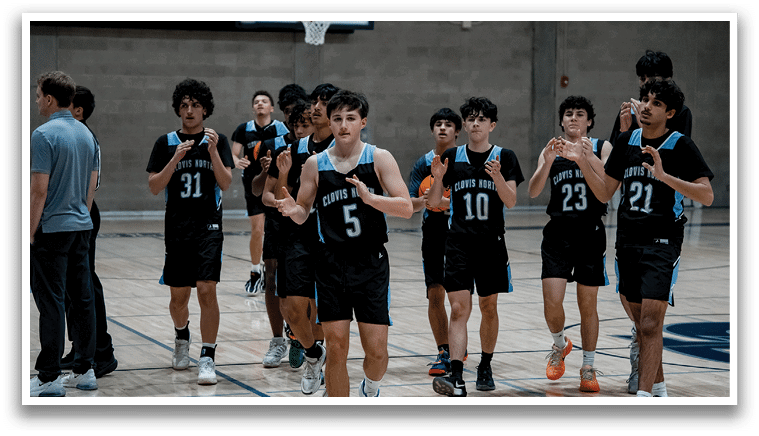A group of young men wearing basketball uniforms are walking on a basketball court. AI generated content