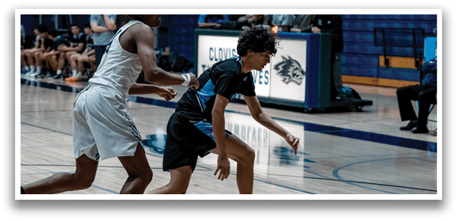 Two basketball players on a court, one wearing a white jersey and the other wearing a black jersey. AI generated content