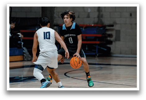 Two men playing basketball, one wearing a white jersey and the other wearing a black jersey. AI generated content
