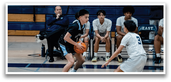 A group of young men playing basketball on a court. AI generated content